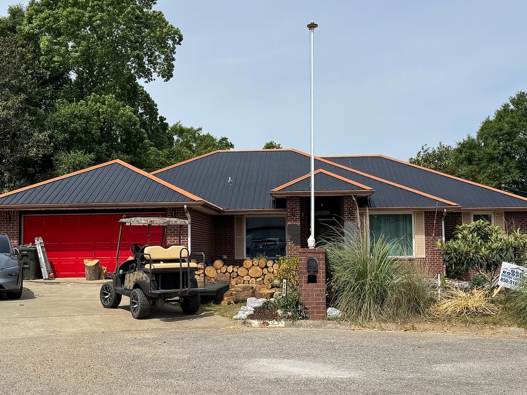 Metal RE-Roof in Pace FL, Black Metal with Copper Trim